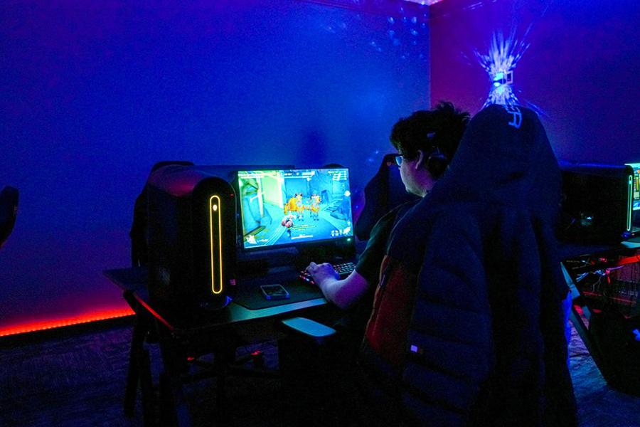 A student gaming in the esports room.