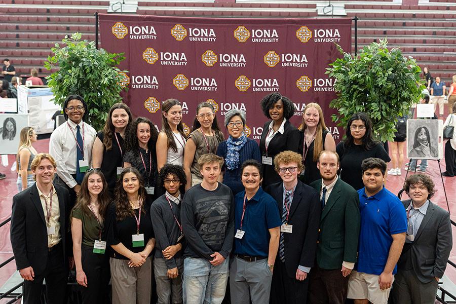 A group of students smiling and posing for a photo on Iona Scholars Day.