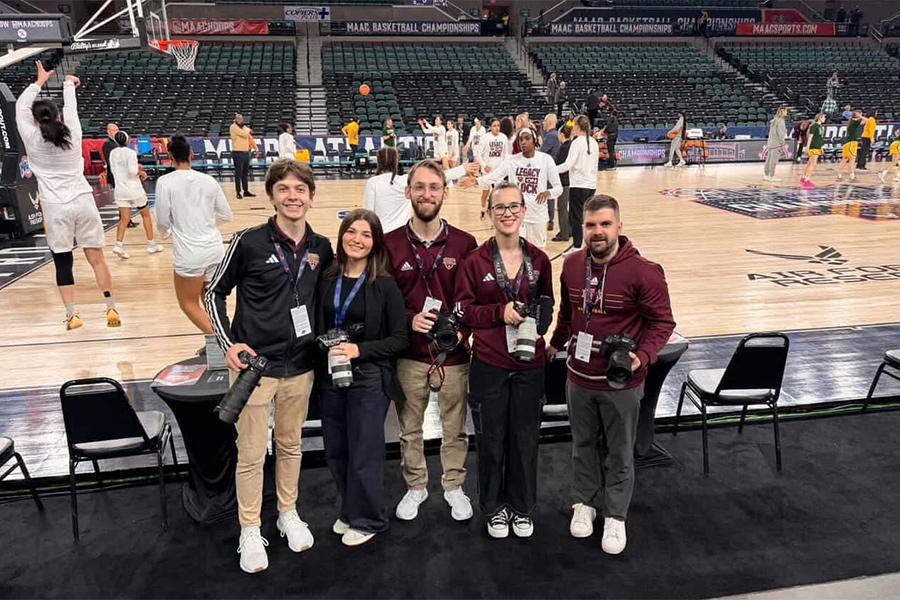 Joe with this students at a MAAC championship game. 