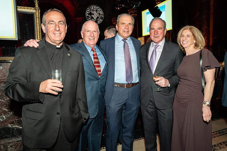 Fr. Kevin with attendees at the Gala.
