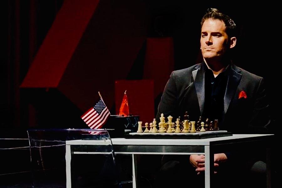 Dalio in a performance playing chess.