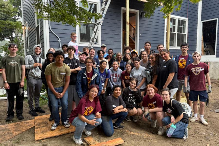 OMM students help to build a house.
