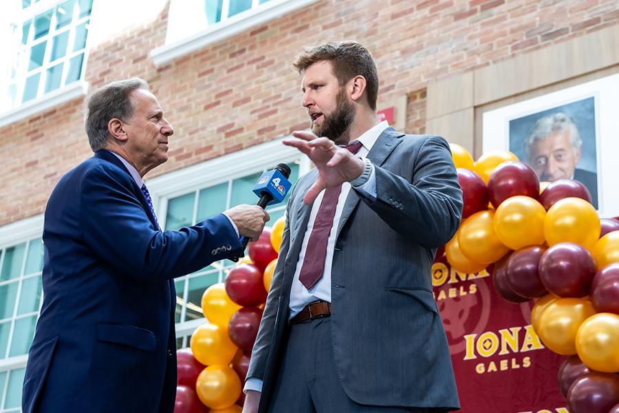 Channel 4 news interviewing Iona's basketball coach.