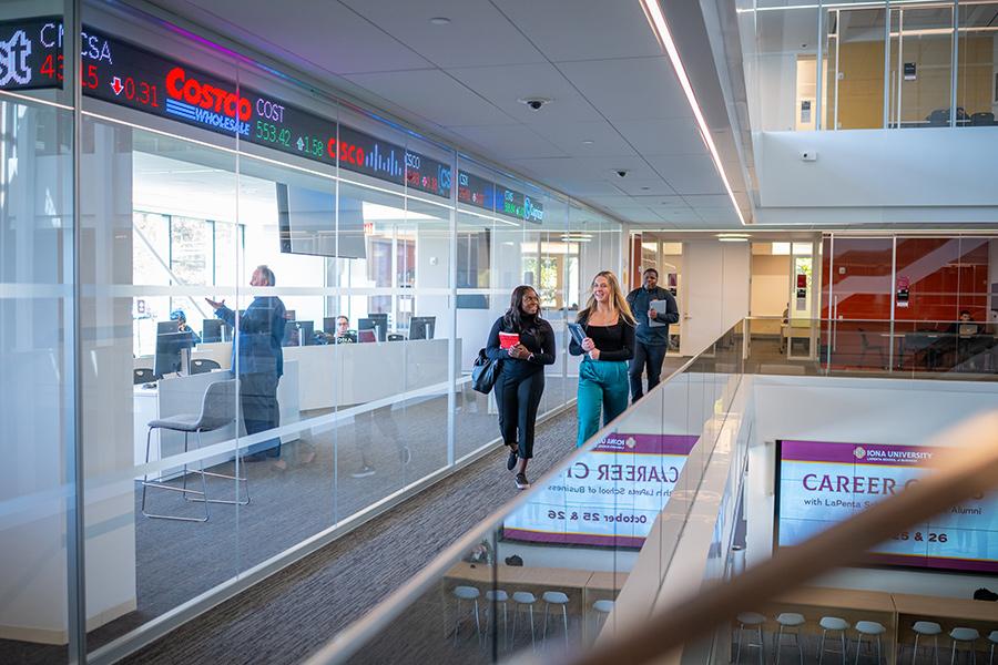Students walk down the hallway in the LaPenta School of Business.