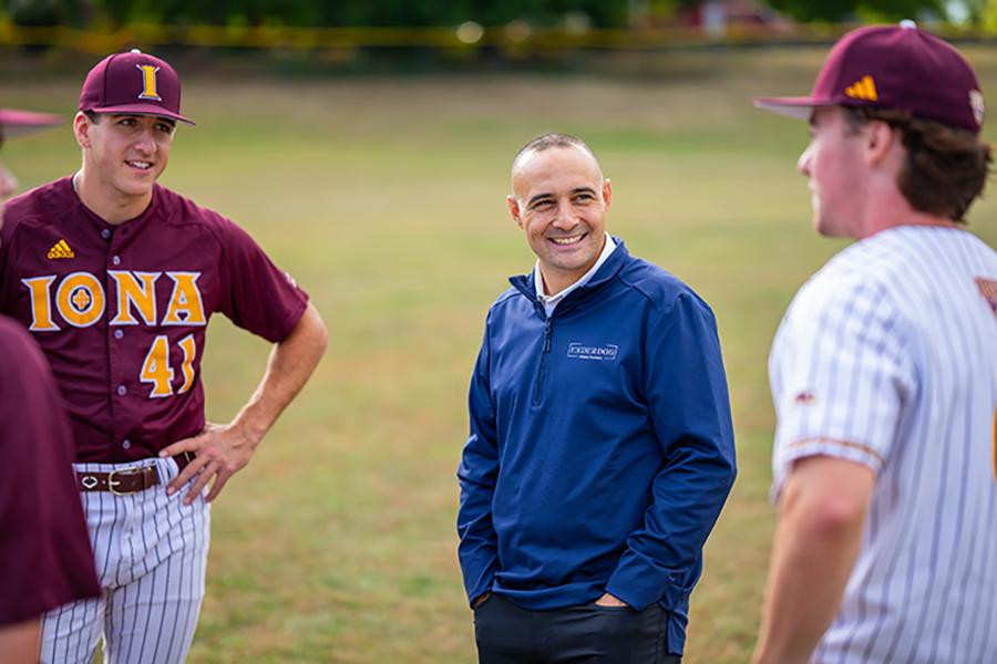 Matt Rizzetta Laughing With Two Baseball Team Members