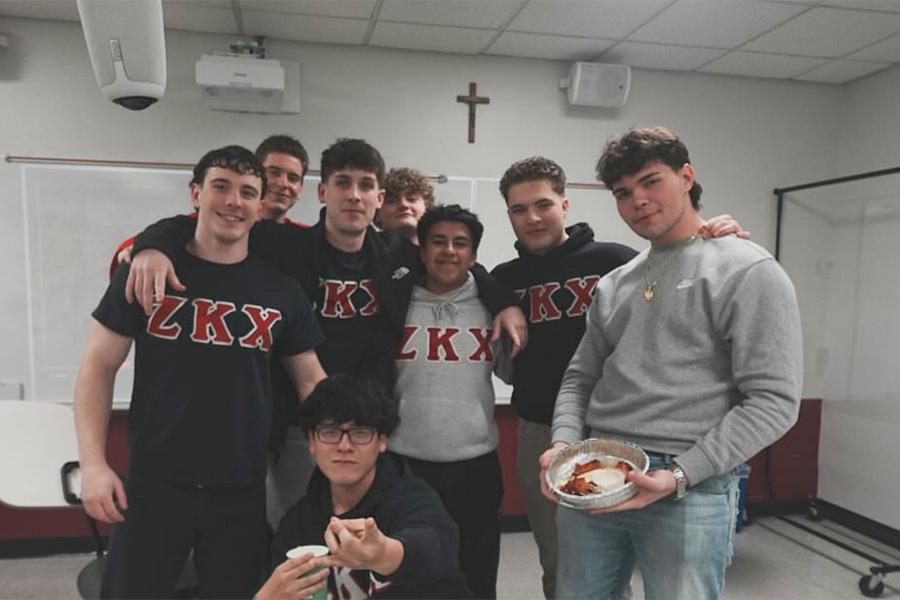 Members of Zeta Kappa Chi in a classroom.