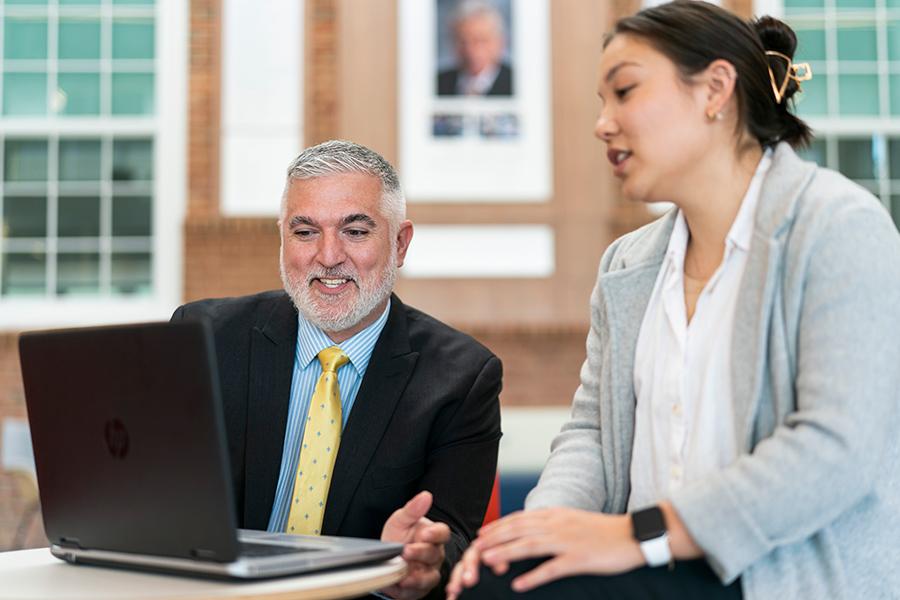 Two MBA health care management students work together on a project.