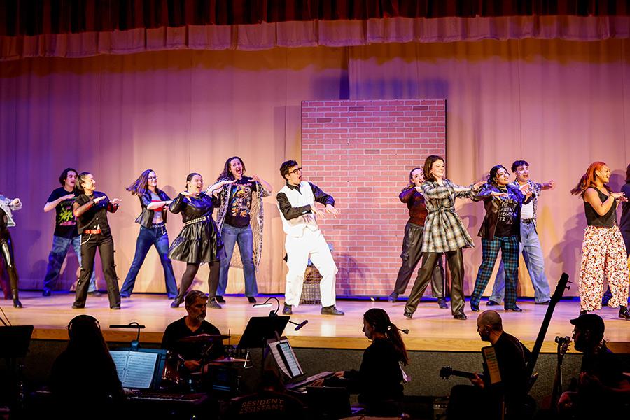 The Iona Players perform on stage. 