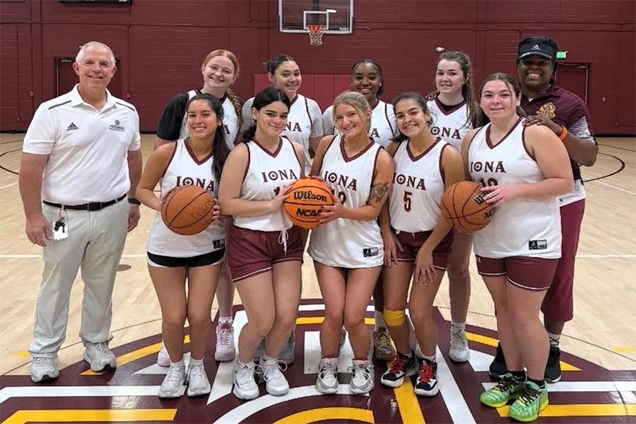 Women's Basketball Players and Coaches Posing For Team Photo