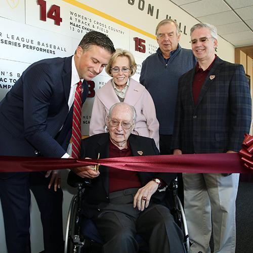 Matt Glovaski, Mary Jane Arrigoni, Jim Hynes and Iona University President Seamus Carey, Ph.D.,  stand with Mr. Arrigoni as he cuts the ribbon.