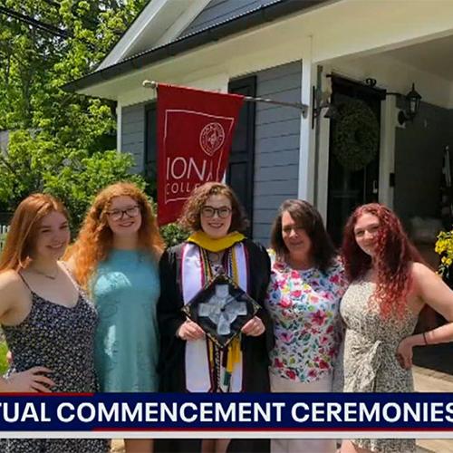 Fox 5 shows Hannah McGowan standing with her family outside of their house to celebrate Iona's 2020 Virtual Commencement.