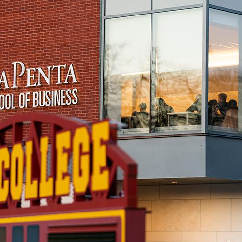 View of classroom in the LaPenta School of Business with the scoreboard from Mazzaella field in the foreground.