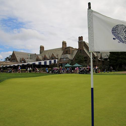 A flag waves in the breeze at the 2019 winged foot golf club fundraiser.