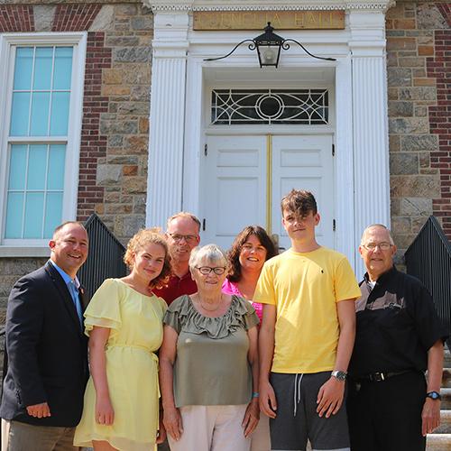 Family members of Br. William Barnabas Cornelia, the College's founding president, with Paul Sutera and Br. Robert Novak.
