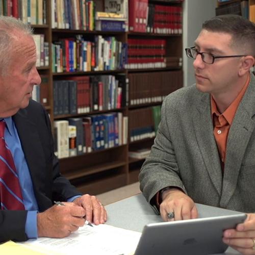 James Laurentius works with one of his professors.