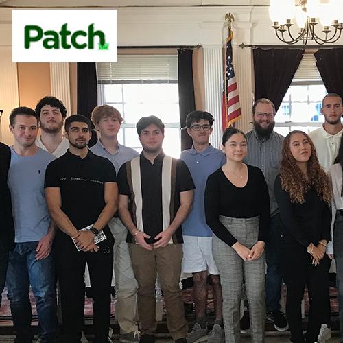 Iona students and Peekskill leadership with the Patch logo.