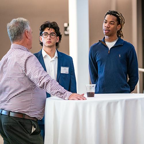 Mentees talk with a mentor at a Gaels Go Further event.