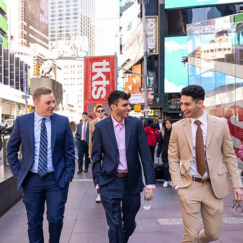 Students walking in Times Square.