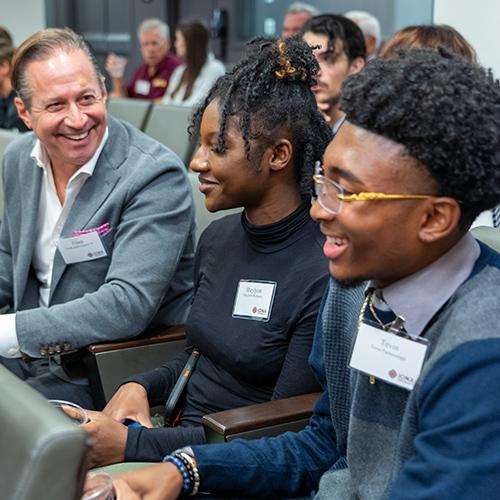 Two Gaels Go Further students talk with a mentor.