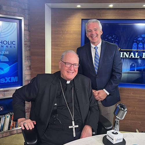 Cardinal Dolan and President Carey.