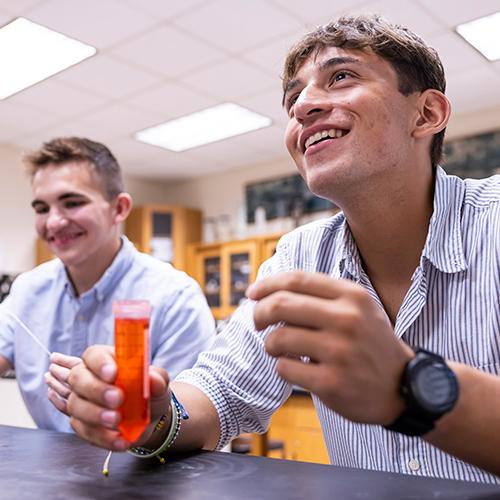 Two students work together in a chemistry class.
