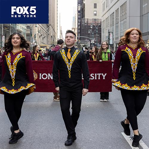 Fox 5 logo in the corner, as Tommy Byrnes is leading the Iona's Irish Dance Team in the St. Patrick's Day Parade.
