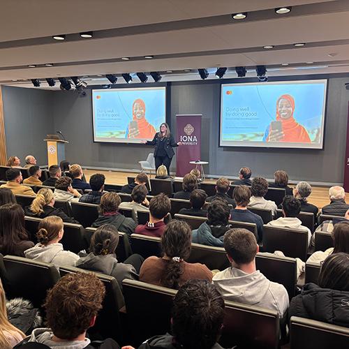 Ellen Jackowski speaking in Henry Lecture Hall to a packed room.