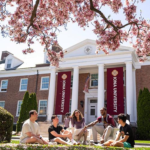 Students talk on the quad on campus.