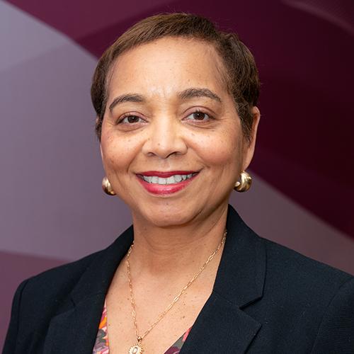 Donna Crisp smiling for a headshot photo.