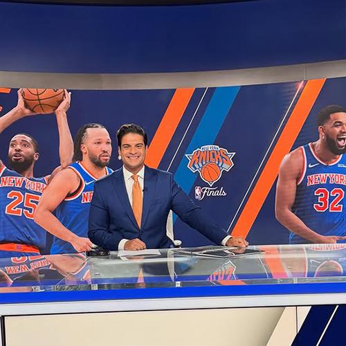 Richard Giacovas behind his desk reporting on the Knicks.