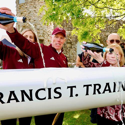 The Trainors christen the Francis T. Trainor Shell with champagne.