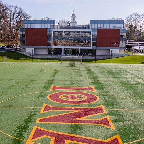 The LaPenta School of Business with Mazzella field in the foreground.