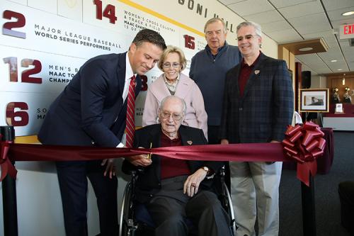 Matt Glovaski, Mary Jane Arrigoni, Jim Hynes and Iona University President Seamus Carey, Ph.D.,  stand with Mr. Arrigoni as he cuts the ribbon.