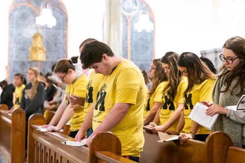Mission and Ministry students bow their heads during the blessing.