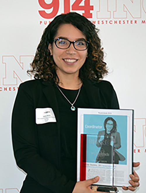 Jarlyne Batista holding her 914Inc Wunderkids award in 2019.