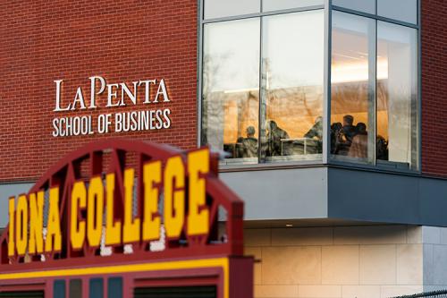 View of classroom in the LaPenta School of Business with the scoreboard from Mazzaella field in the foreground.