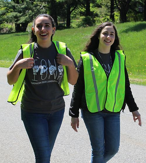 Two students from the ASL club at the HLAA walk for hearing.