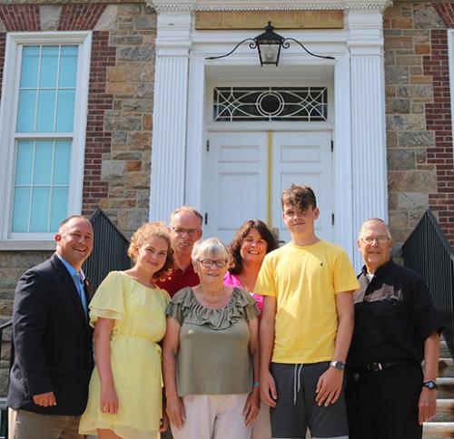 Family members of Br. William Barnabas Cornelia, the College's founding president, with Paul Sutera and Br. Robert Novak.