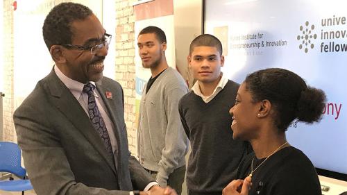 Dr. Wheeler congratulates the three students who won Stanford University Fellowships.