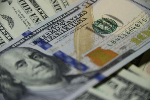 A close-up shot of a 100 dollar bill.