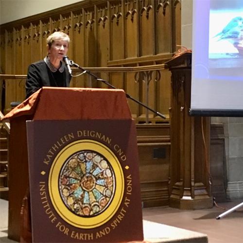 Sister Deignan stands at the podium in the Arrigoni Center.