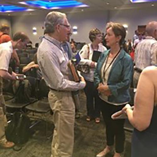 Attendees networking at Creighton University.