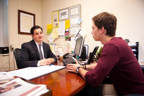 A student talks with a staff member from the Office of Career Development.