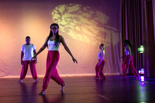 The Iona College Dance Ensemble performs on stage.