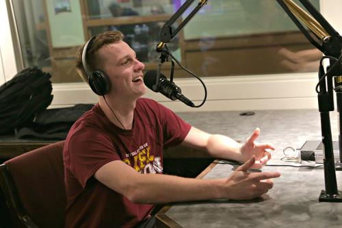 A student on the mic at the radio station in LaPenta.