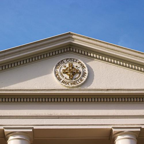 Iona College seal on a building.