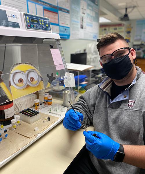 AJ Liles working in the chemistry lab.