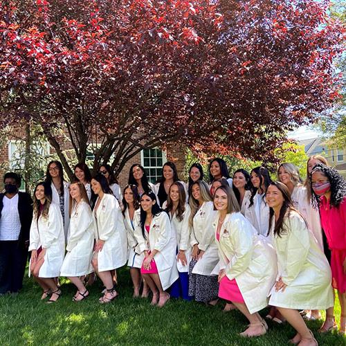 Recipients after receiving their white coats at the ceremony held at Iona University. 