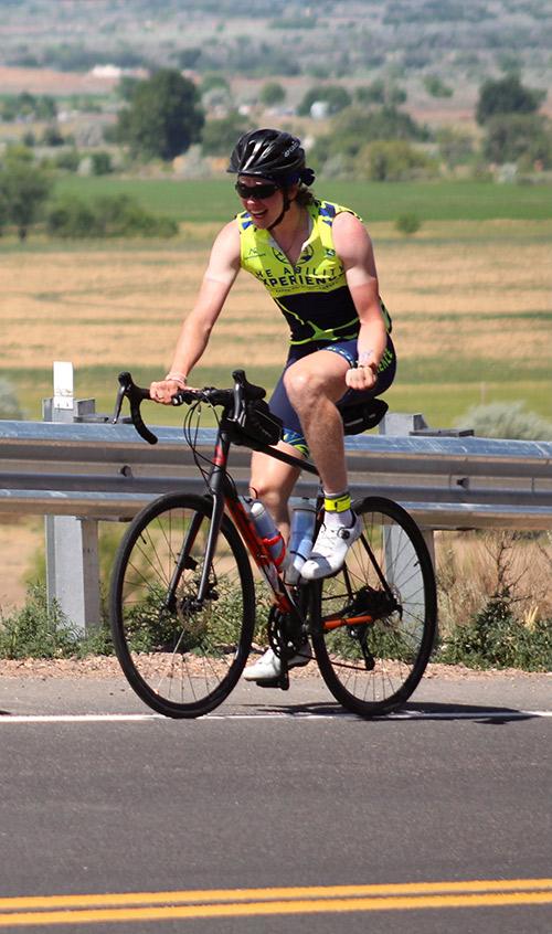 Aidan Connolly joyfully rides his bike. 