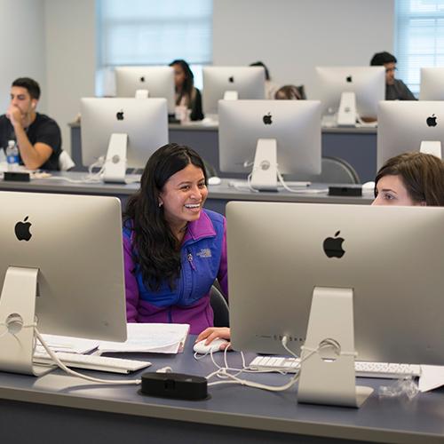 Students do reasearch for computer science in the lab.